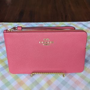 Coach large corner zip wristlet - fuchsia